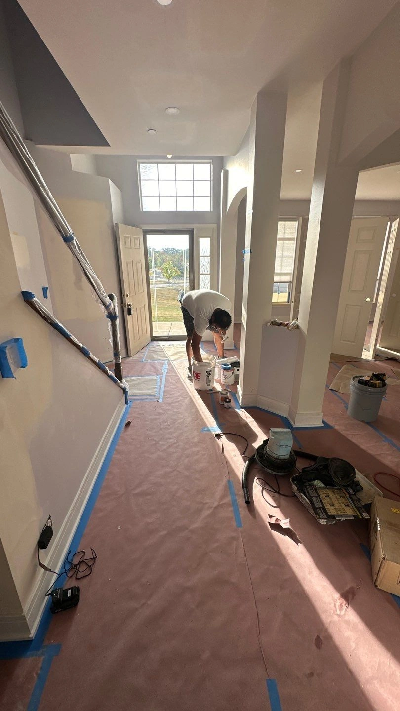 Painter working in a newly renovated interior space