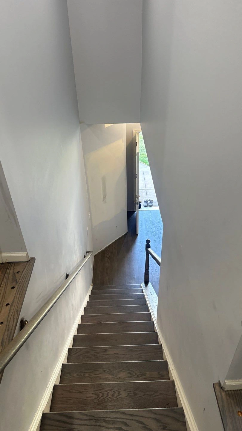 View of wooden stairs leading downwards